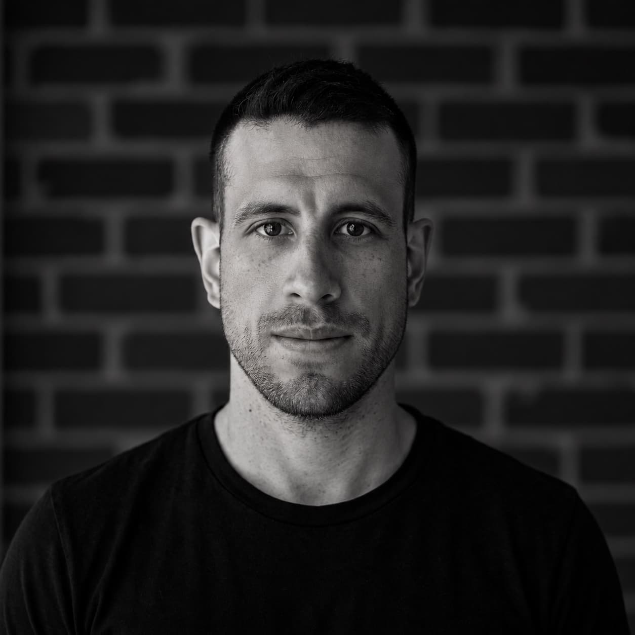 Black-and-white headshot of Christopher Nieves